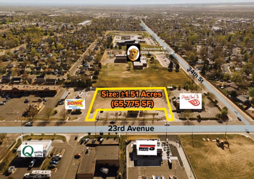 For Sale-3350 23rd Ave, Evans, CO - Aerial view of a 1.51-acre Vacant Lot along 23rd Avenue, bordered by Sonic and Swan Cakes, with nearby businesses, residential areas, and a school labeled in the background; streets are labeled 23rd Avenue and 34th St.
