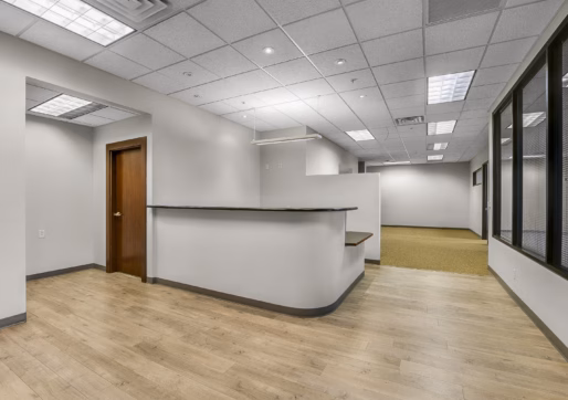Suite 150 - Front desk and reception area with view towards open work area